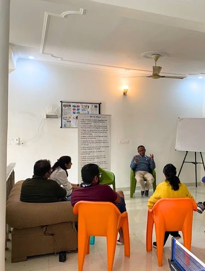 A therapist at a rehabilitation centre explaining the importance of proper alcohol treatment.