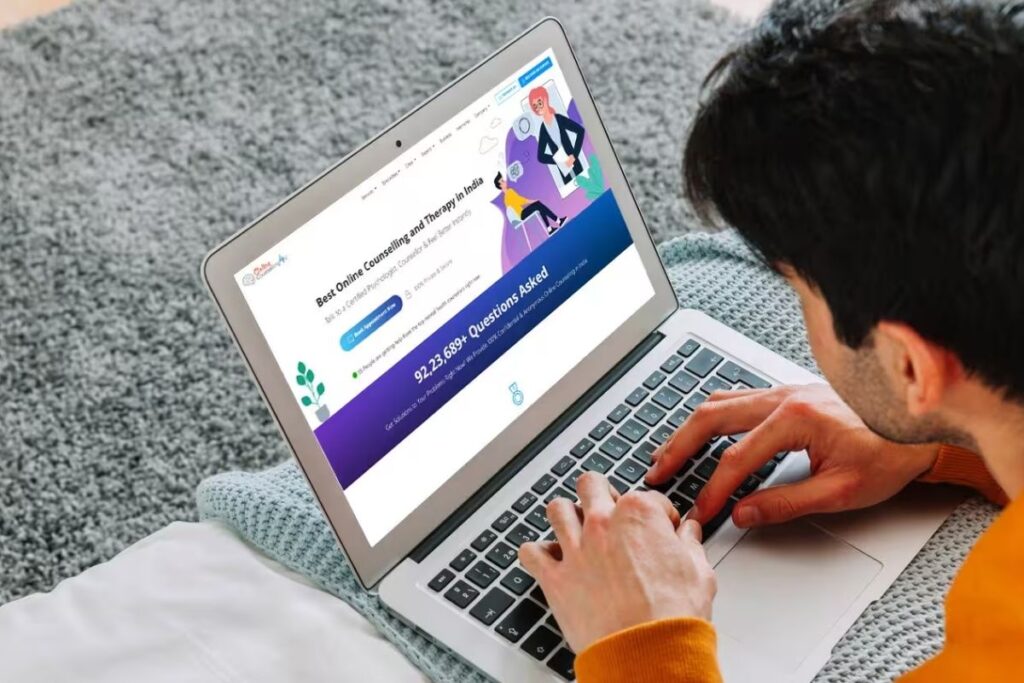 Young person searching for online counselling and therapy in India.