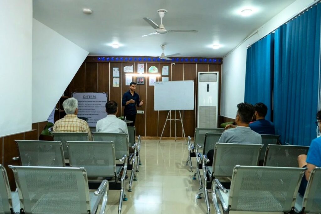 Patients in group counselling at a rehab centre in Delhi