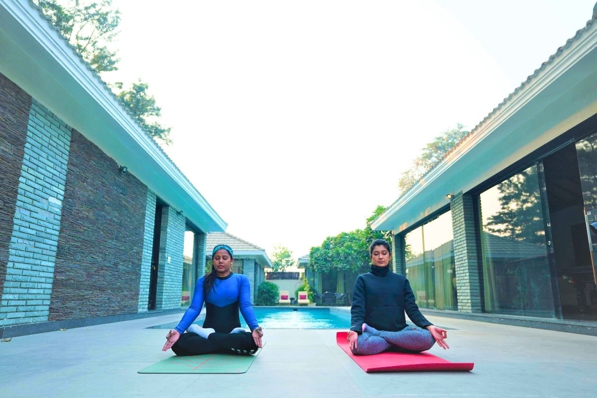 Women practicing meditation at a luxury rehab center in India
