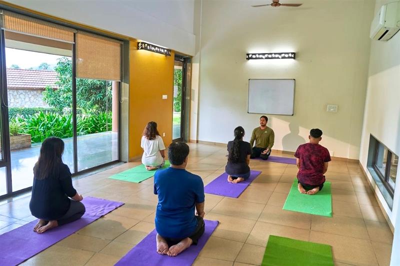 Alcohol addicts practising yoga at a rehab centre