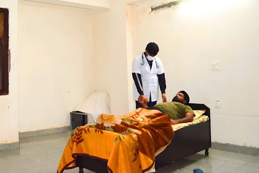 Staff and a patient in a Detox therapy at a drug de-addiction centre in Chandigarh.