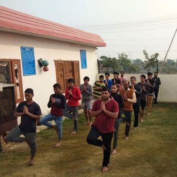 People in rehab practicing yoga as part of holistic addiction recovery in India