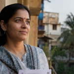 Woman reviewing a Reliable Nasha Mukti Kendra Near Me with Patient Reviews and star ratings.