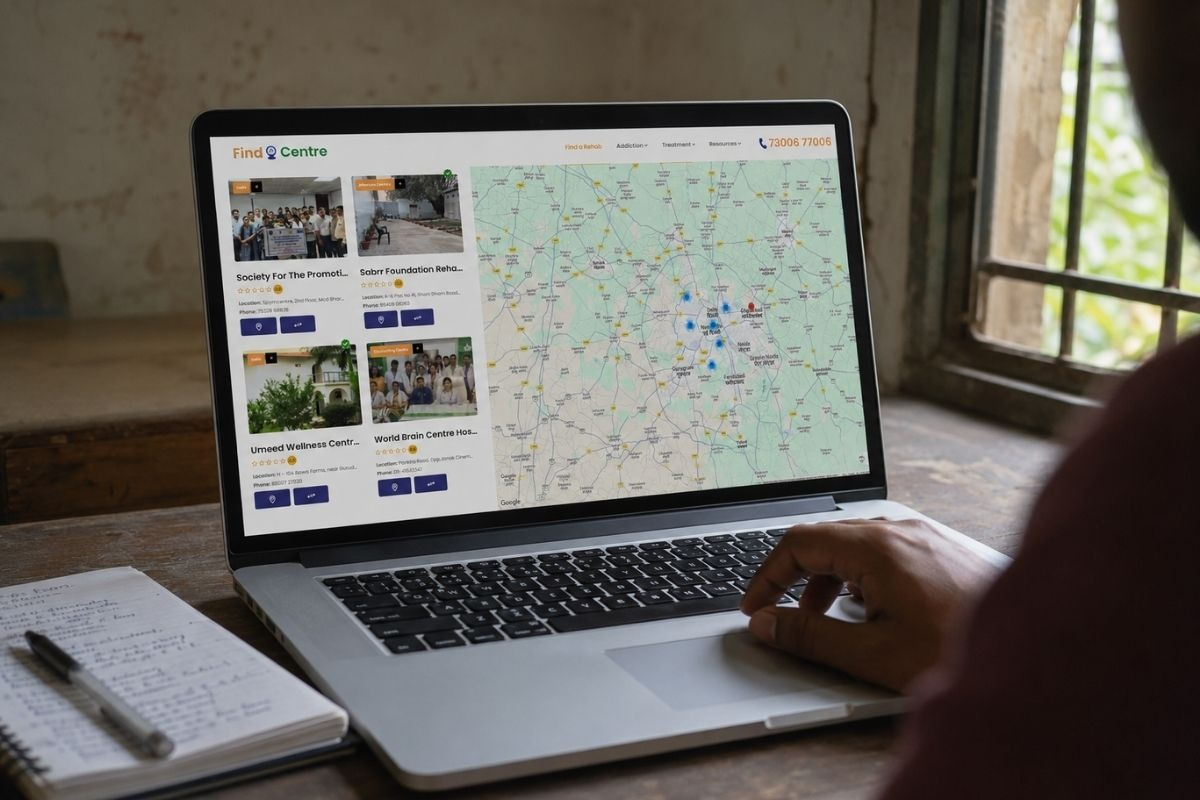 Person using a laptop to browse Find Rehab Centres, comparing rehabilitation centres on an interactive location map.