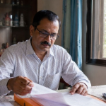 Rehab centre employee reviewing the Cost of Rehab in India in 2026, including treatment expenses and hidden charges.